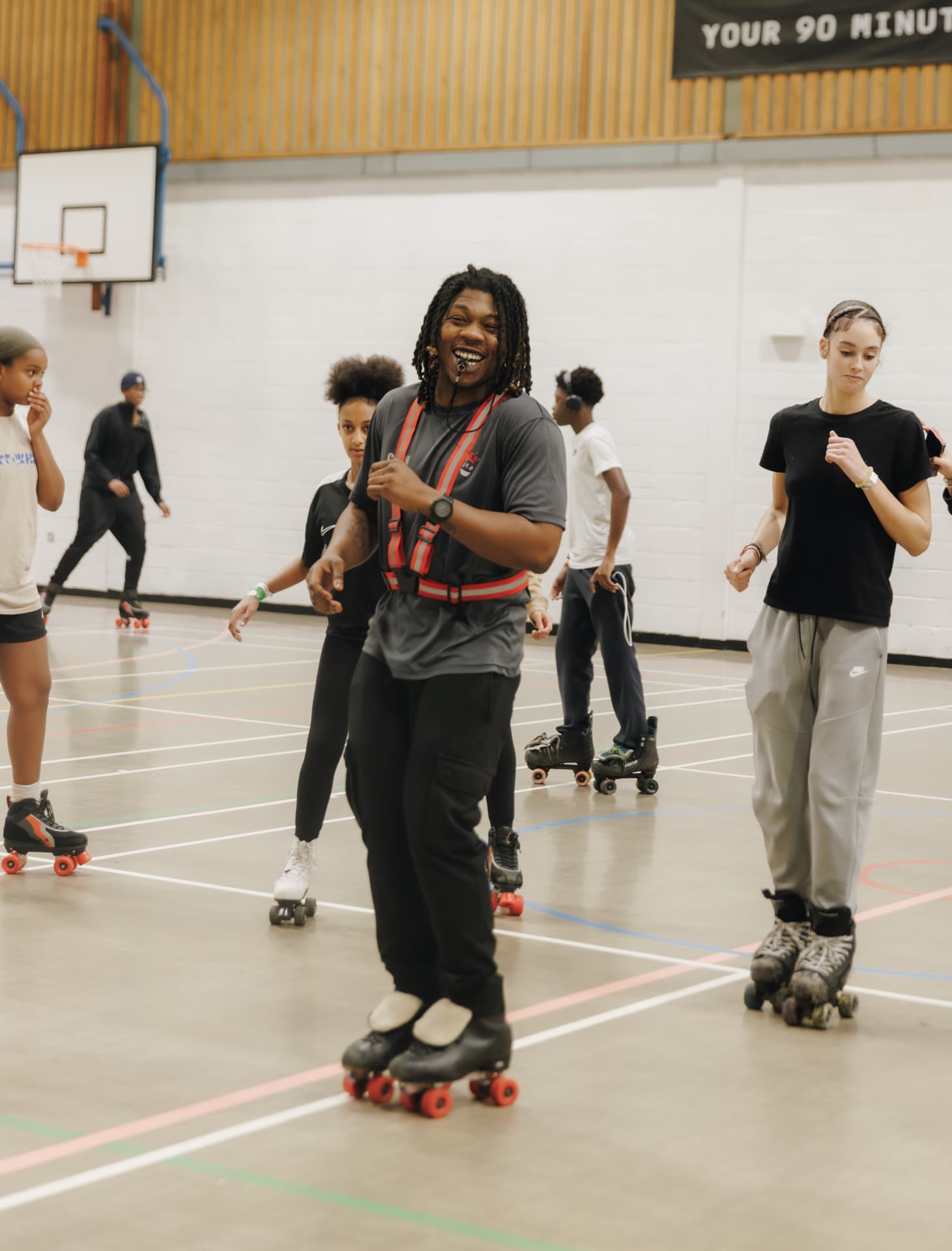 Roller skaters at a Just Keep Rollin indoor class