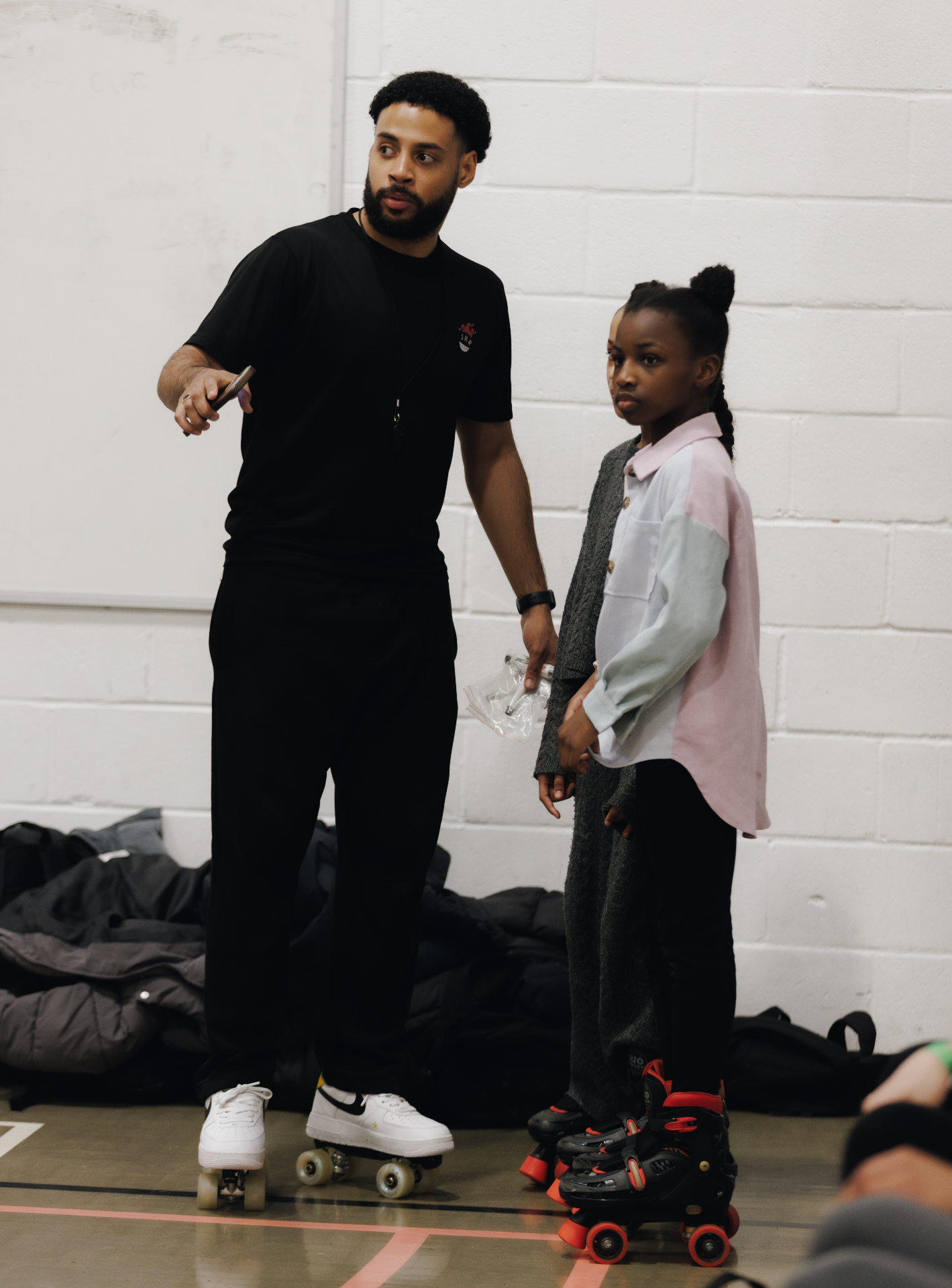 Coach working one-to-one with a skater