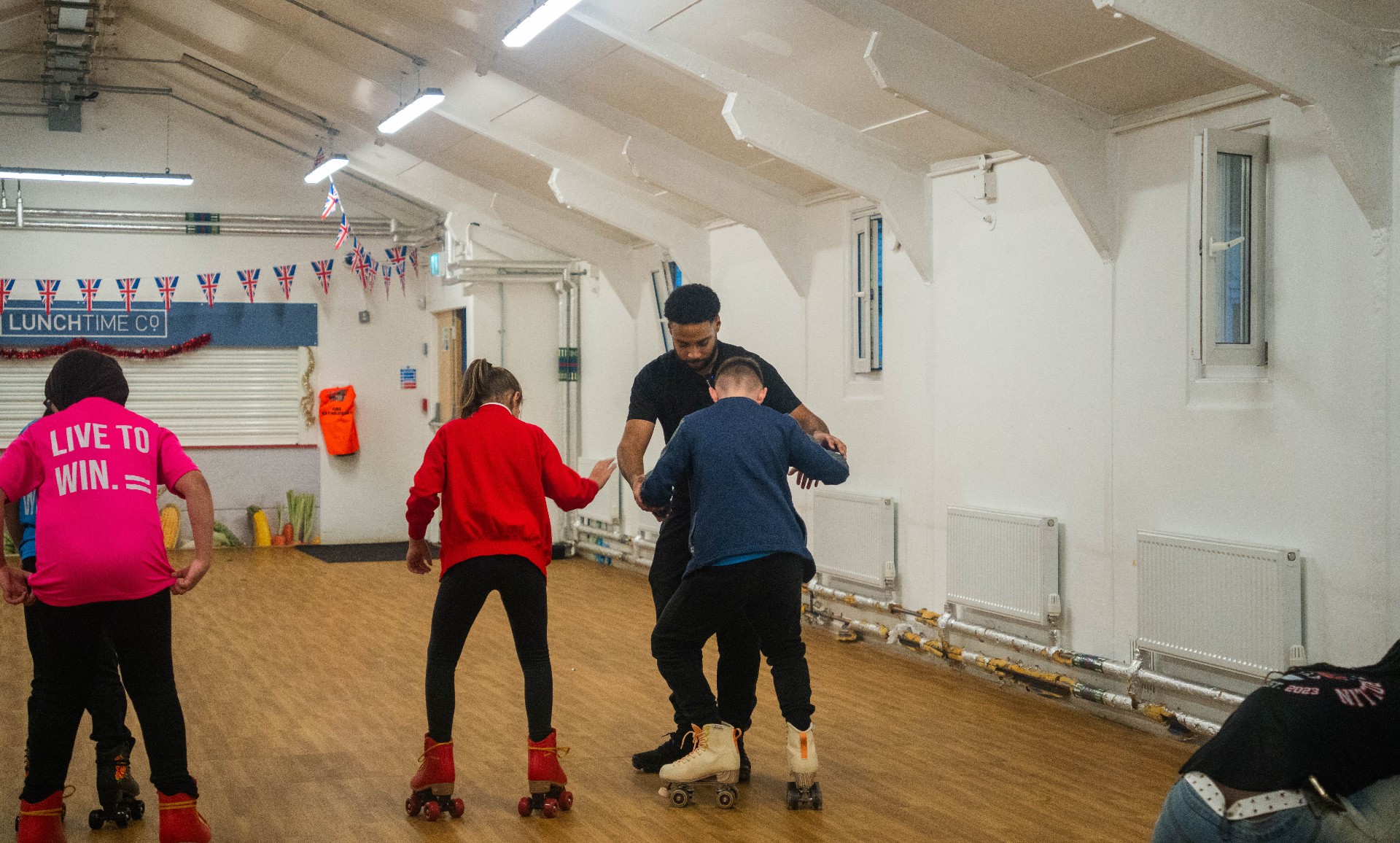 Coach giving hands-on guidance mid-session