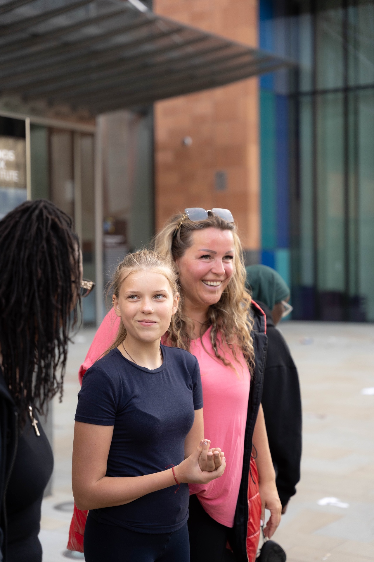 Skaters smiling outside the venue