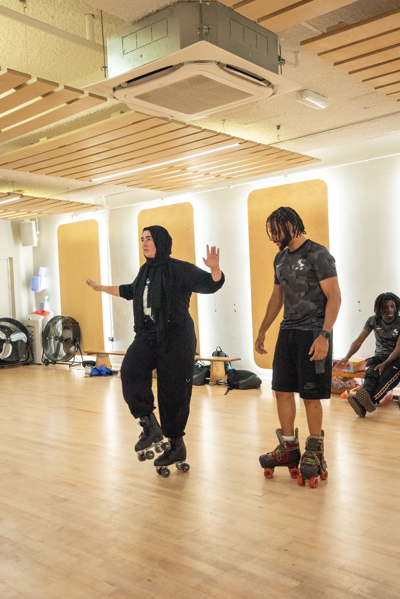 Coach demonstrating a move in the studio